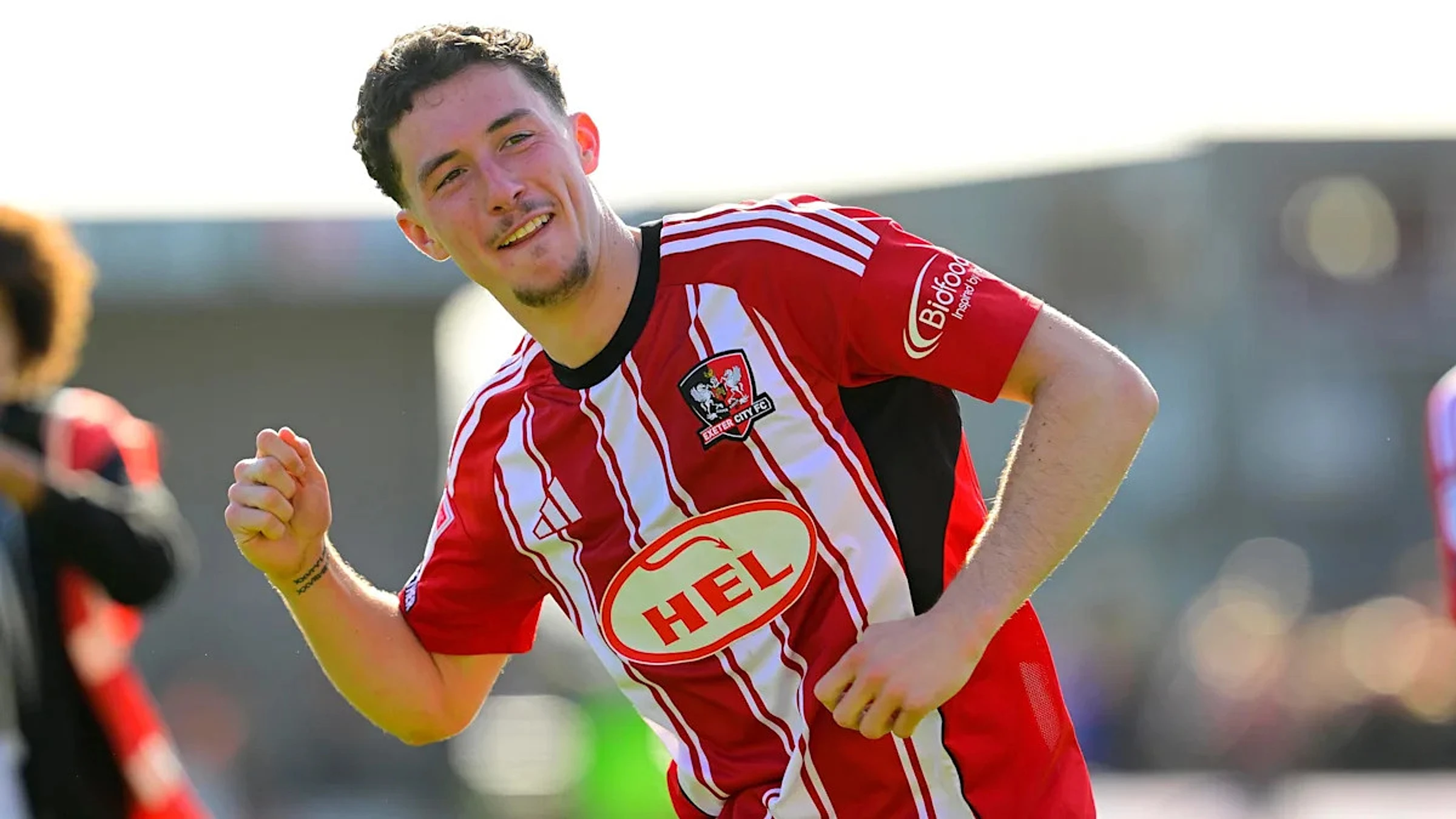 Exeter midfielder Cummins signs one-year extension