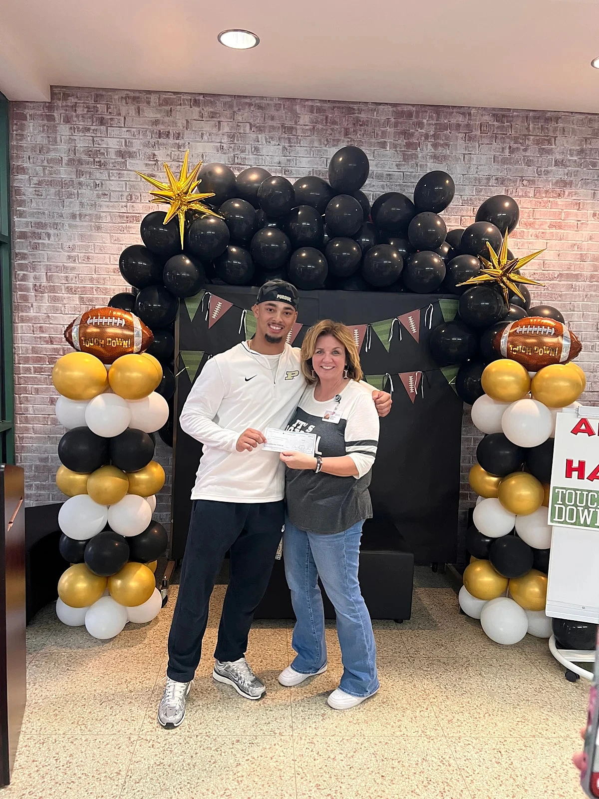 Purdue and former Castle running back Antonio Harris gives back - Image 1