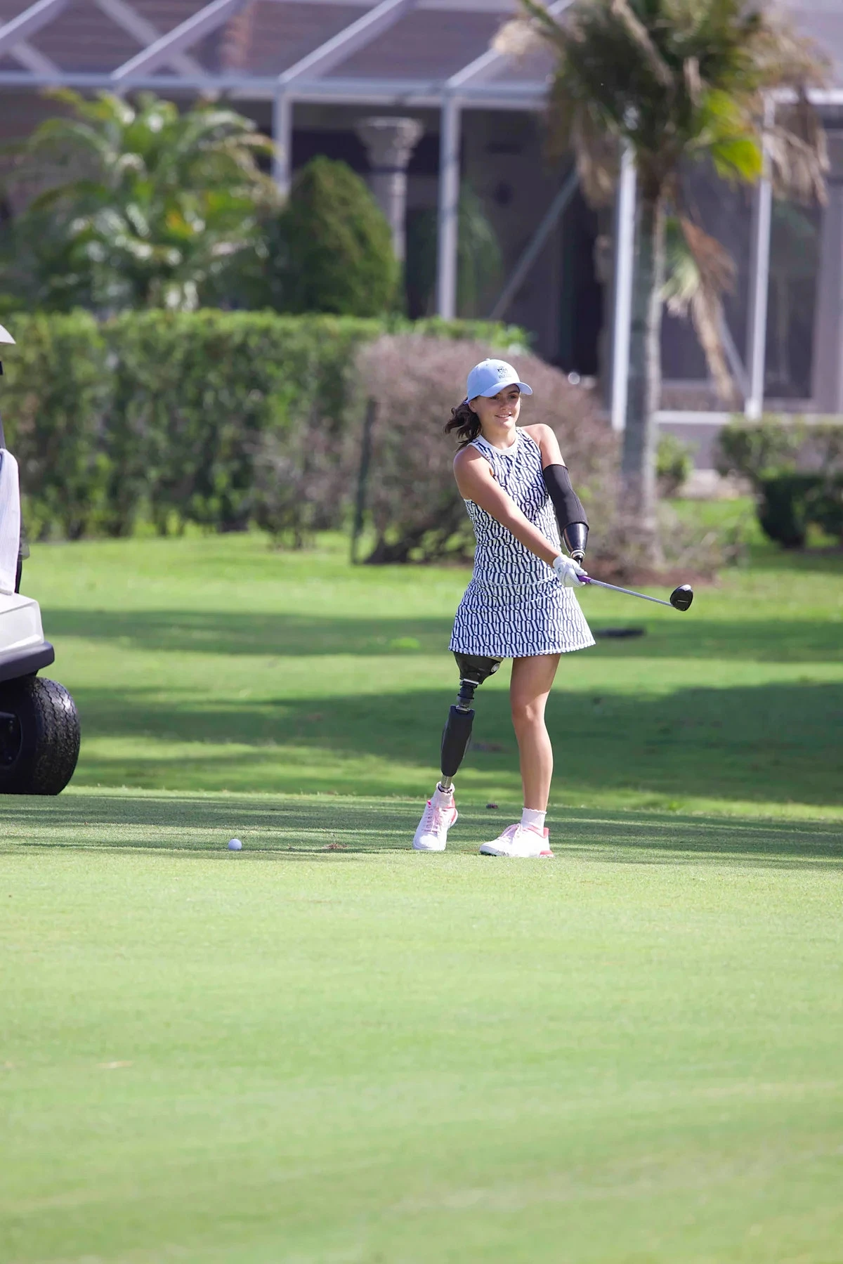 Shark attack survivor Lulu Gribbin plays golf with prosthetic arm, leg - Image 1