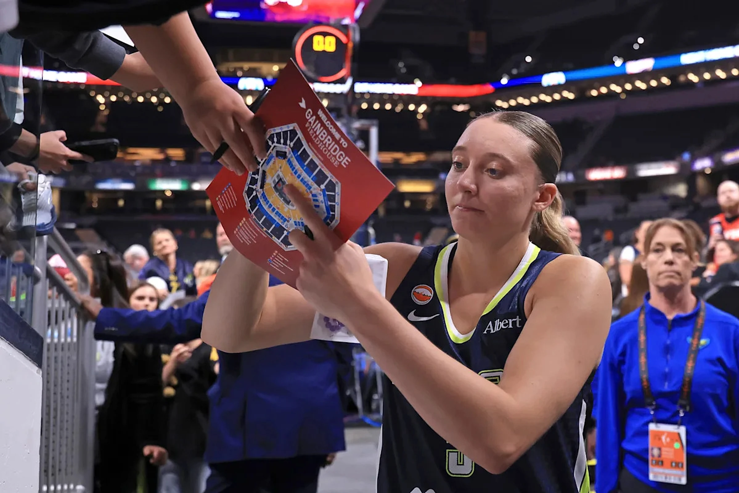 Rock, paper, scissors showdown ends with Paige Bueckers giving fan signed sneakers