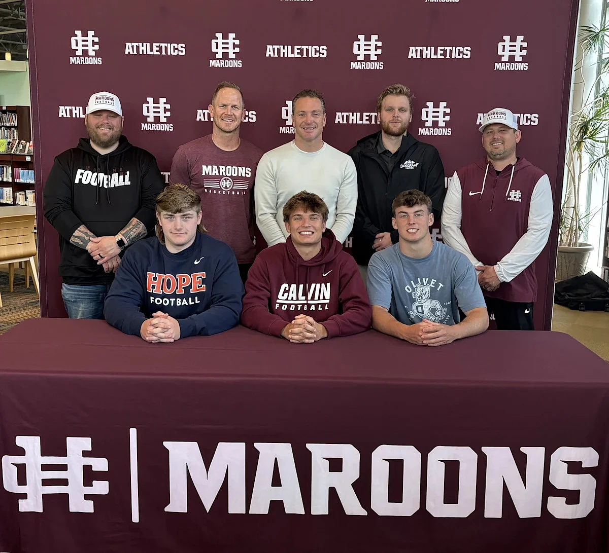 Eight Holland Christian athletes make college commitments official