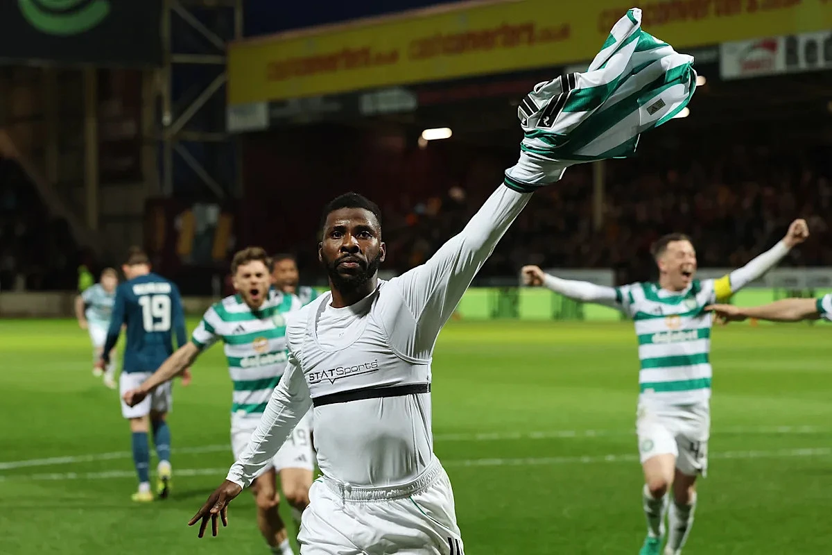 Celtic scores injury-time penalty to take the Scottish title race to the final game of the season